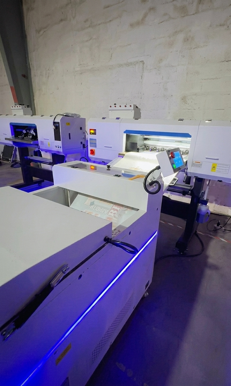 BW 8074-3 DTF printer running high-efficiency production inside a busy custom POD printing factory.